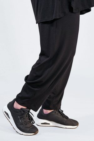 The model in this photo is wearing black Noen jersey harem trousers