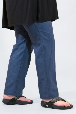 The model in this photo is wearing K J Brand Wash & Go trousers in denim available in plus sizes from Bakou