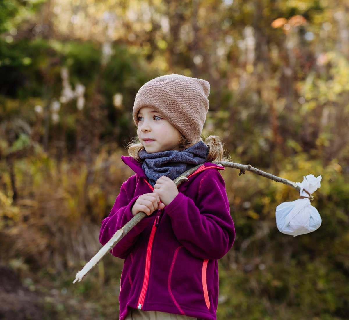 Little girl with biddle or hobo stick