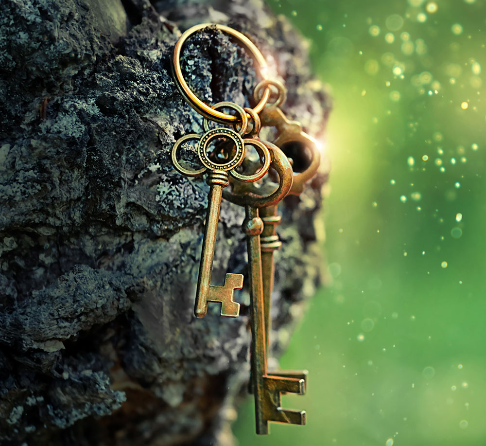 Antique keys in a green magical background