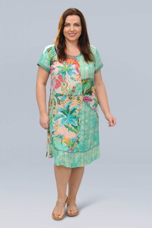 The model in this photo is wearing a vibrant, fresh Orientique Hanalei dress in plus sizes at Bakou London