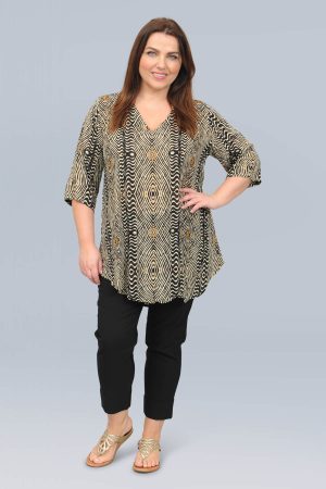 The model in this photo is wearing a mid length v neck tunic in a striking ethnic print from Angel Circle at Bakou London