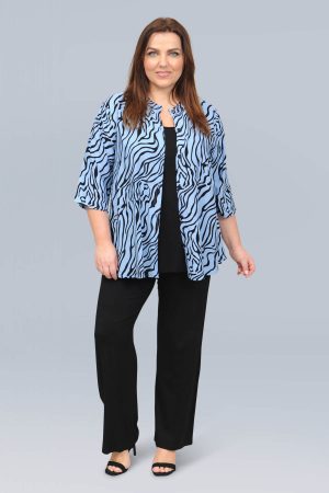 The model in this photo is wearing a stylish short shirt in a funky squiggle print by Danish plus size experts Angel Circle at Bakou London