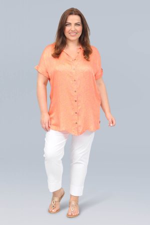 The model in this photo is wearing a silky soft short sleeved shirt by plus size experts Ciso at Bakou