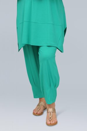 The model in this photo is wearing super cool Noen jersey harem trousers in a cool mint colour from Bakou London