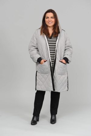 The model in this photo is wearing a Pont Neuf Liva reversible coat for the ultimate in functional but stylish fashion for plus size ladies