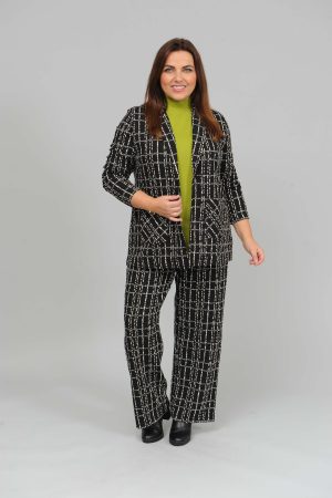 The model in this photo is wearing a divine check suit from German plus size specialists See You or Biggi M. It has elastane for more comfort and stretch.