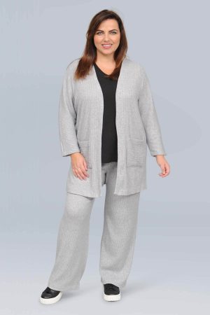 The model in this photo is wearing an on trend long cardi with matching knitted trousers by plus size experts See You or Biggi M at Bakou London