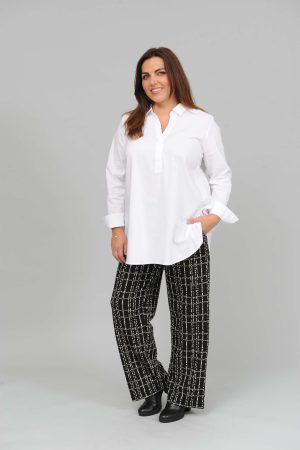 The model in this photo is wearing a Via Appia white shirt style tunic with stretch for larger ladies at Bakou