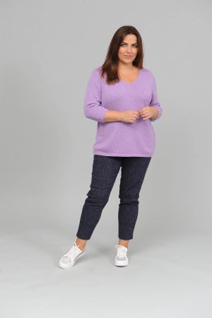 The model in this photo is wearing a v neck 3/4 sleeve jumper from German plus size experts Via Appia at Bakou London