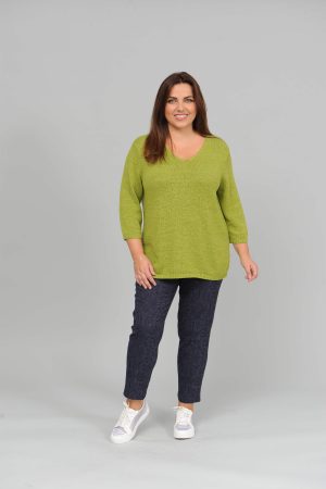 The model in this photo is wearing a flattering v neck cotton mix jumper by plus size specialists Via Appia at Bakou London