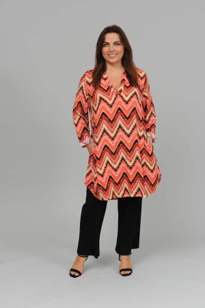 The model in this photo is wearing a long tunic or dress in a funky zig zag design by Via Appia at Bakou London