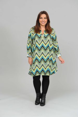 The model in this photo is wearing a long tunic or dress in a funky zig zag design by Via Appia at Bakou London