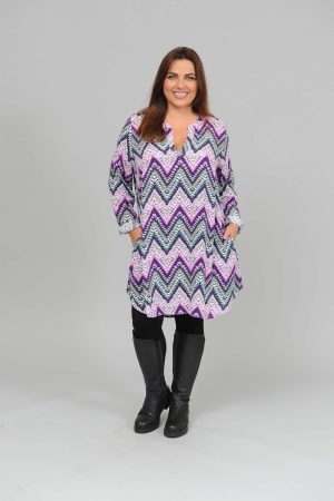 The model in this photo is wearing a long tunic or dress in a funky zig zag design by Via Appia at Bakou London