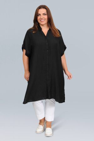 The model in this photo is wearing an oversized short sleeved shirt/dress for larger sizes at Bakou London